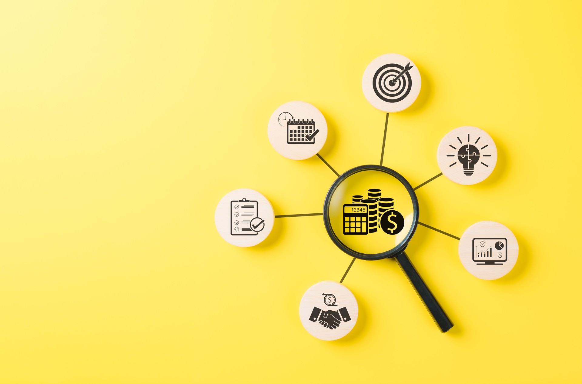 Budget Planning and Financial Management Concept. Magnifying glass on finance icons like a calculator, coins, and calendar, symbolizing budget planning, financial analysis, and economic goal setting.